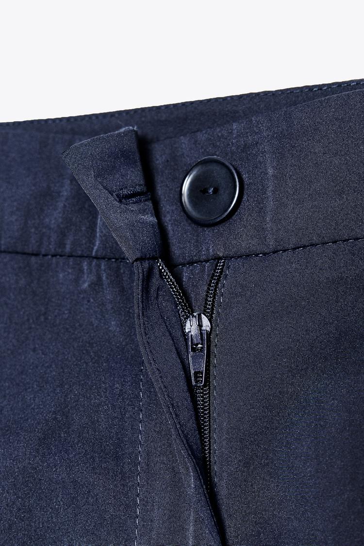 PLEATED LONG BERMUDA SHORTS